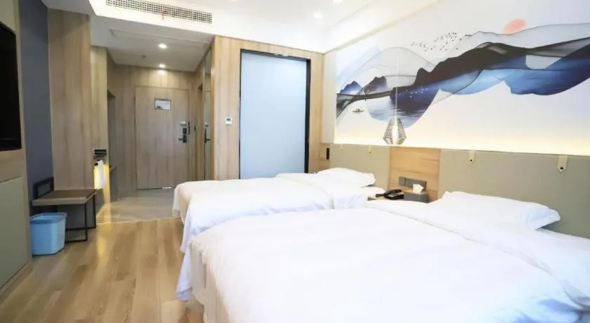 Bed in VX Hotel Jiangsu Taizhou Xinghua RT-Mart