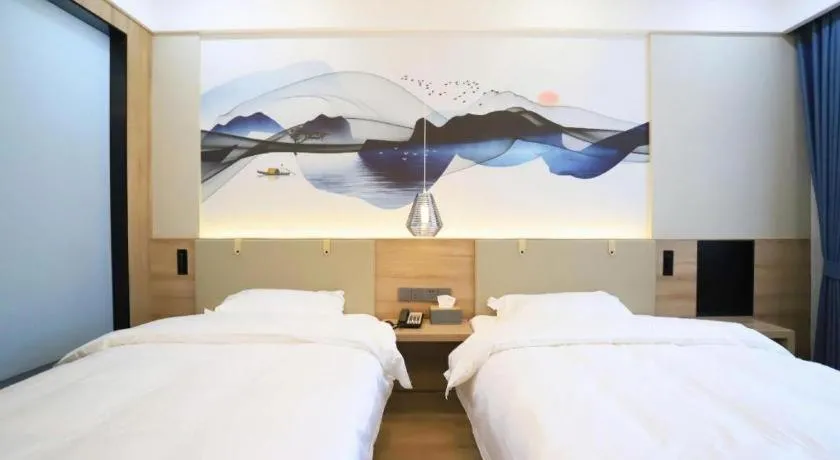 Bed in VX Hotel Jiangsu Taizhou Xinghua RT-Mart