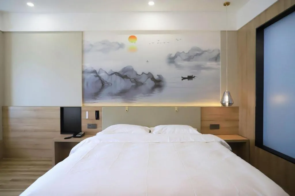 Bed in VX Hotel Jiangsu Taizhou Xinghua RT-Mart