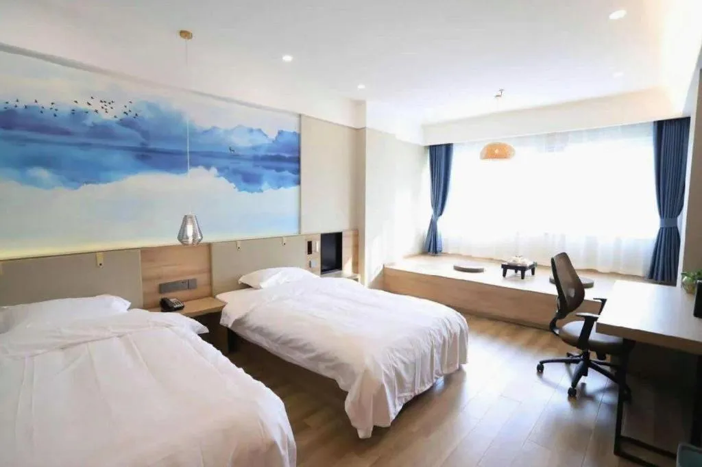 Bed in VX Hotel Jiangsu Taizhou Xinghua RT-Mart