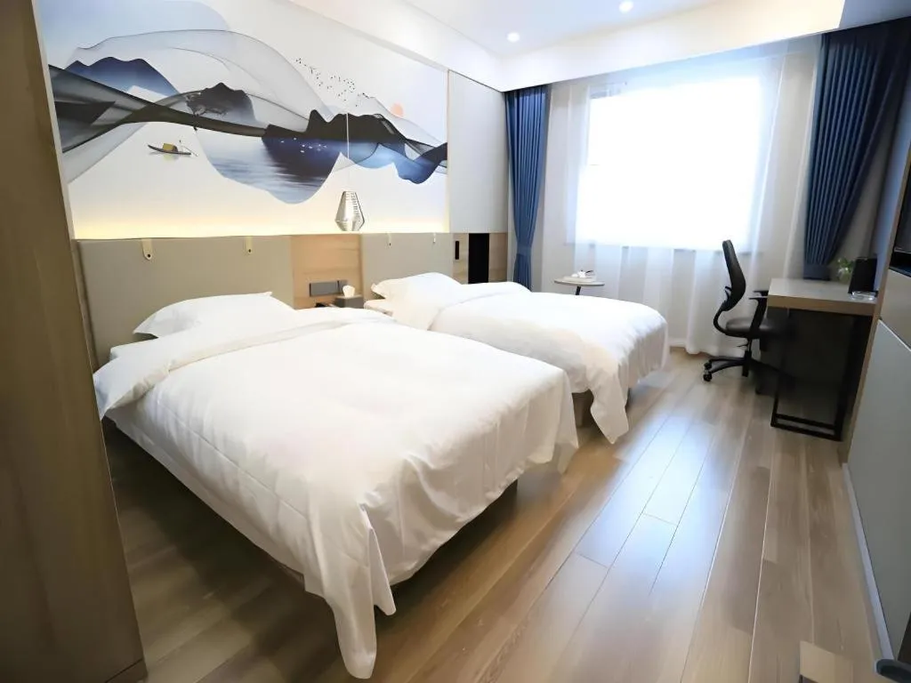 Bed in VX Hotel Jiangsu Taizhou Xinghua RT-Mart