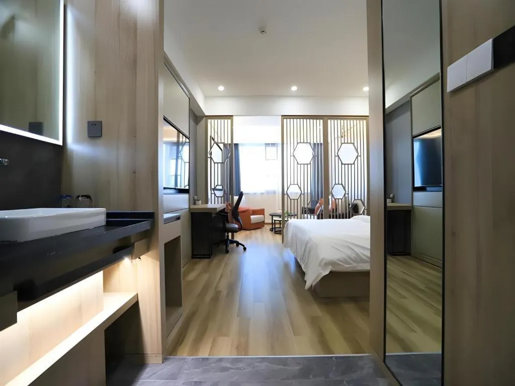 Bed in VX Hotel Jiangsu Taizhou Xinghua RT-Mart