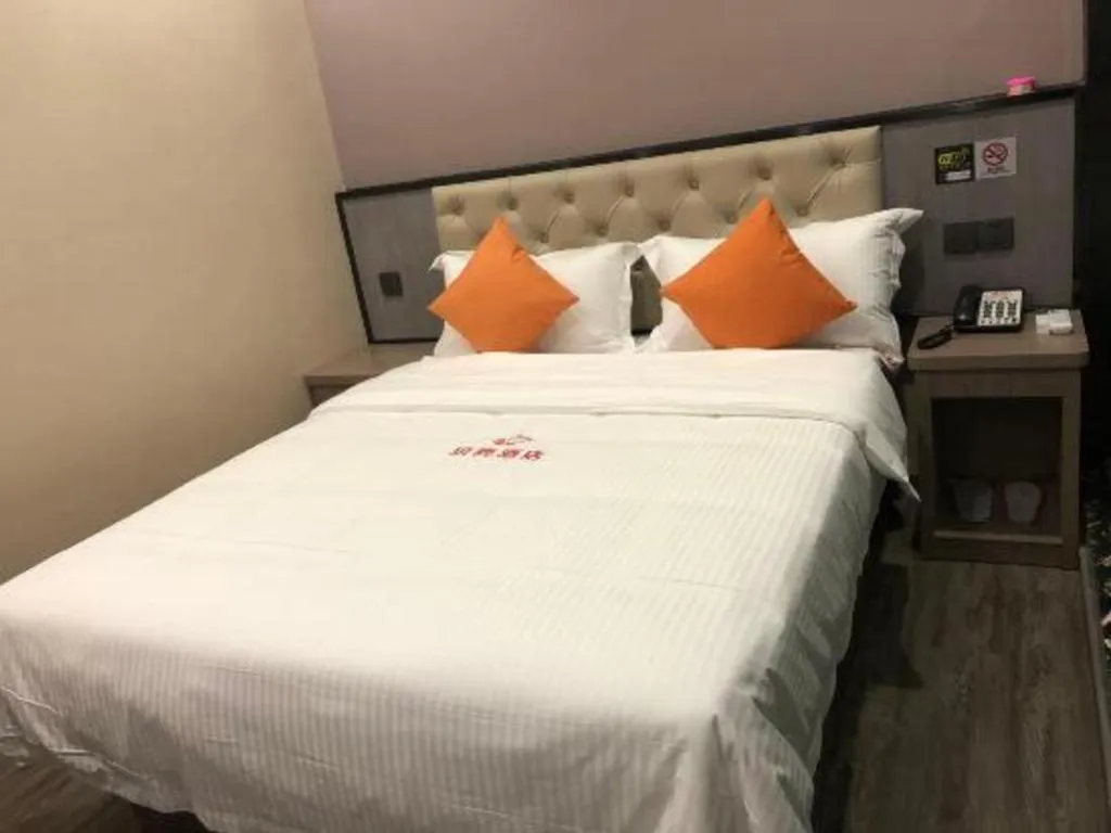 Bed in Shell Hotel Shanghai Jinshan Wanda Plaza