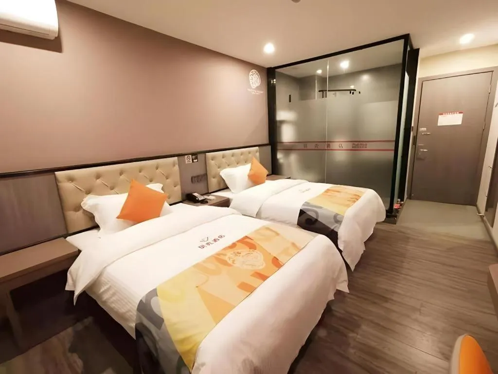 Bed in Shell Hotel Shanghai Jinshan Wanda Plaza