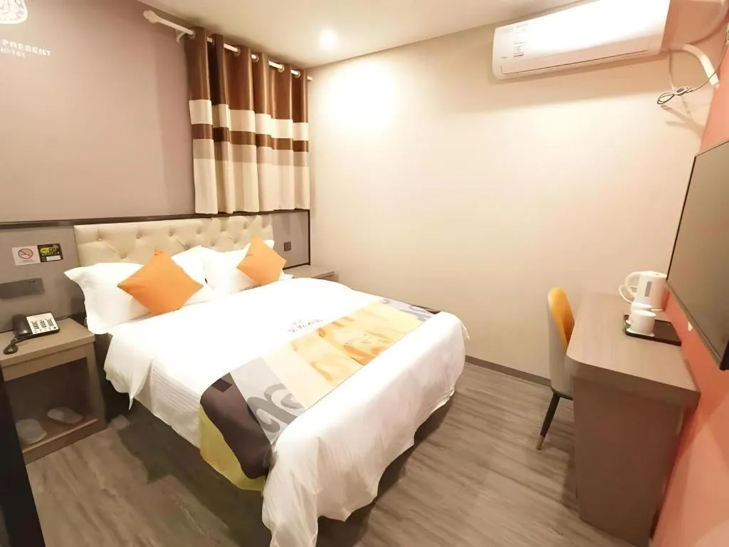 Bed in Shell Hotel Shanghai Jinshan Wanda Plaza
