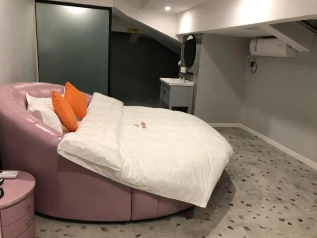 Bed in Shell Hotel Shanghai Jinshan Wanda Plaza