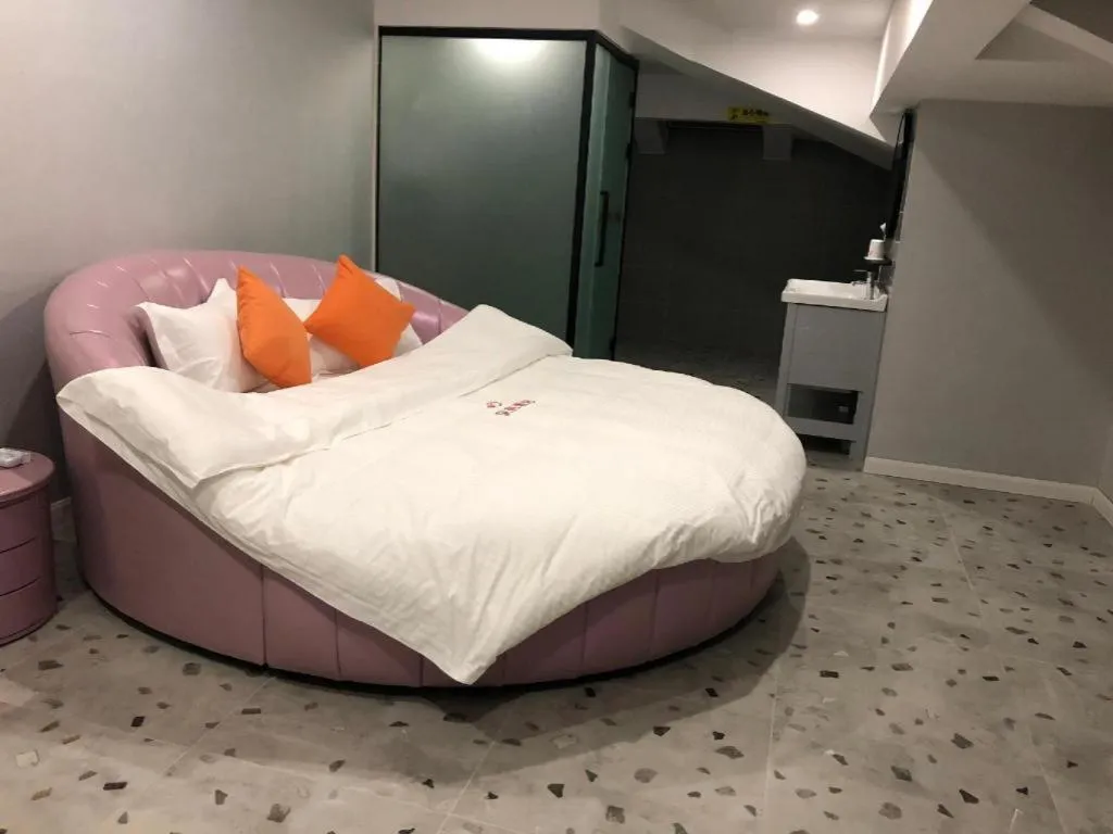 Bed in Shell Hotel Shanghai Jinshan Wanda Plaza