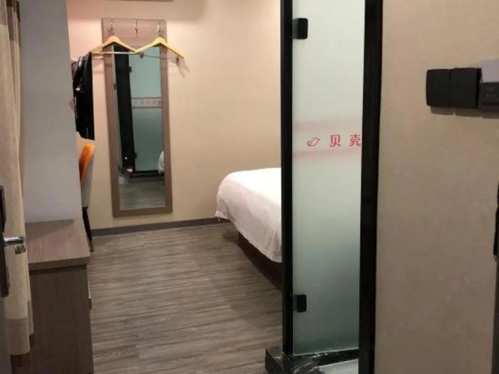 Bed in Shell Hotel Shanghai Jinshan Wanda Plaza