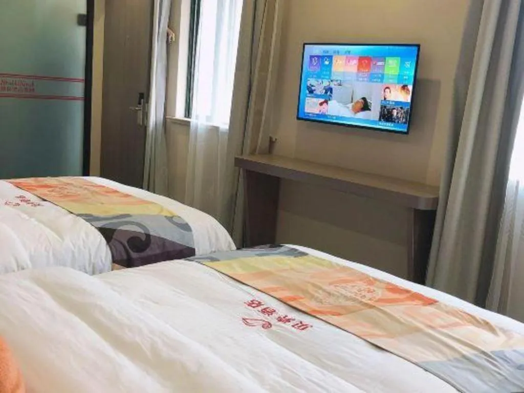 Bed in Shell Hotel Shanghai Jinshan Wanda Plaza