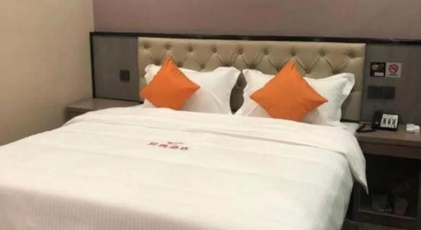 Bed in Shell Hotel Shanghai Jinshan Wanda Plaza