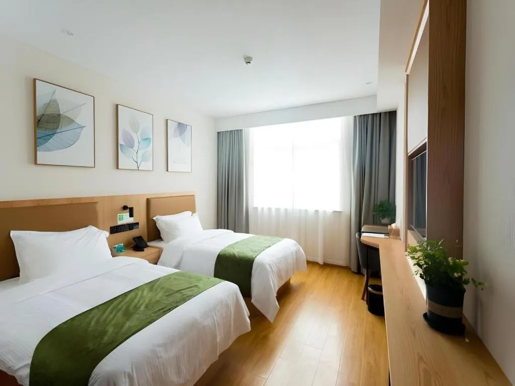 Bed in GreenTree Inn Express Henan Xinyang Huaibin County