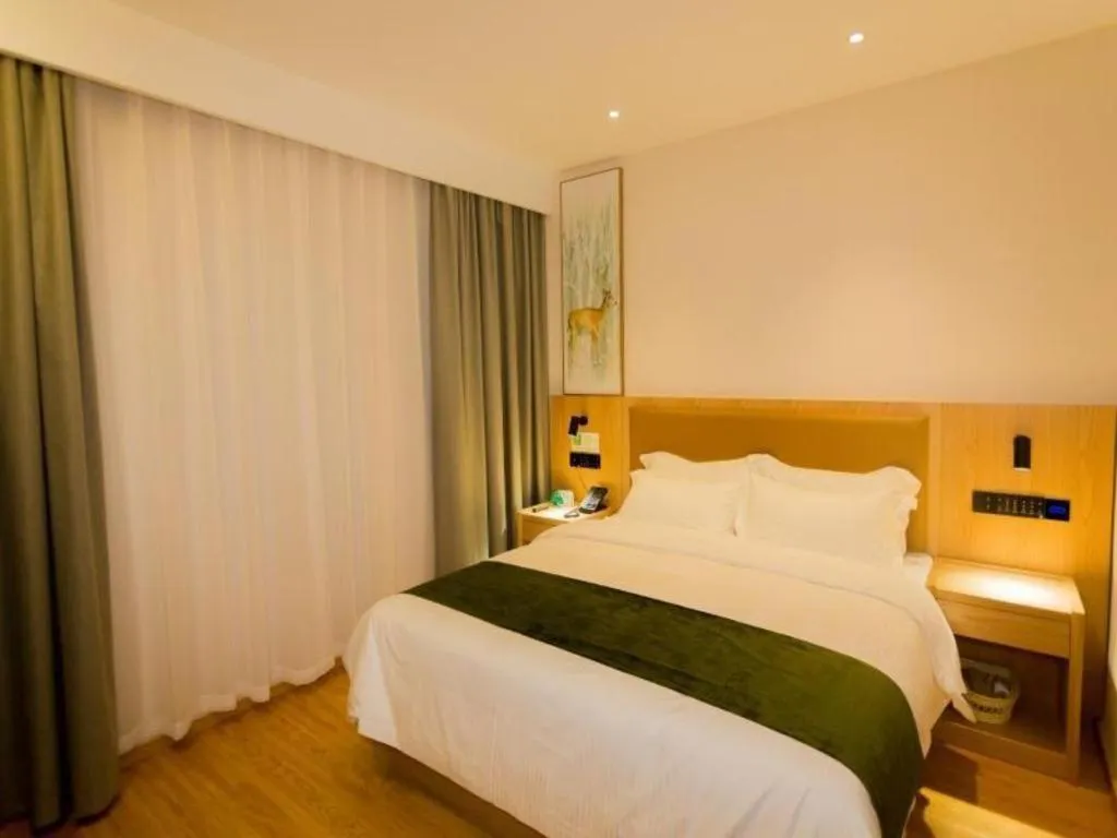 Bed in GreenTree Inn Express Henan Xinyang Huaibin County