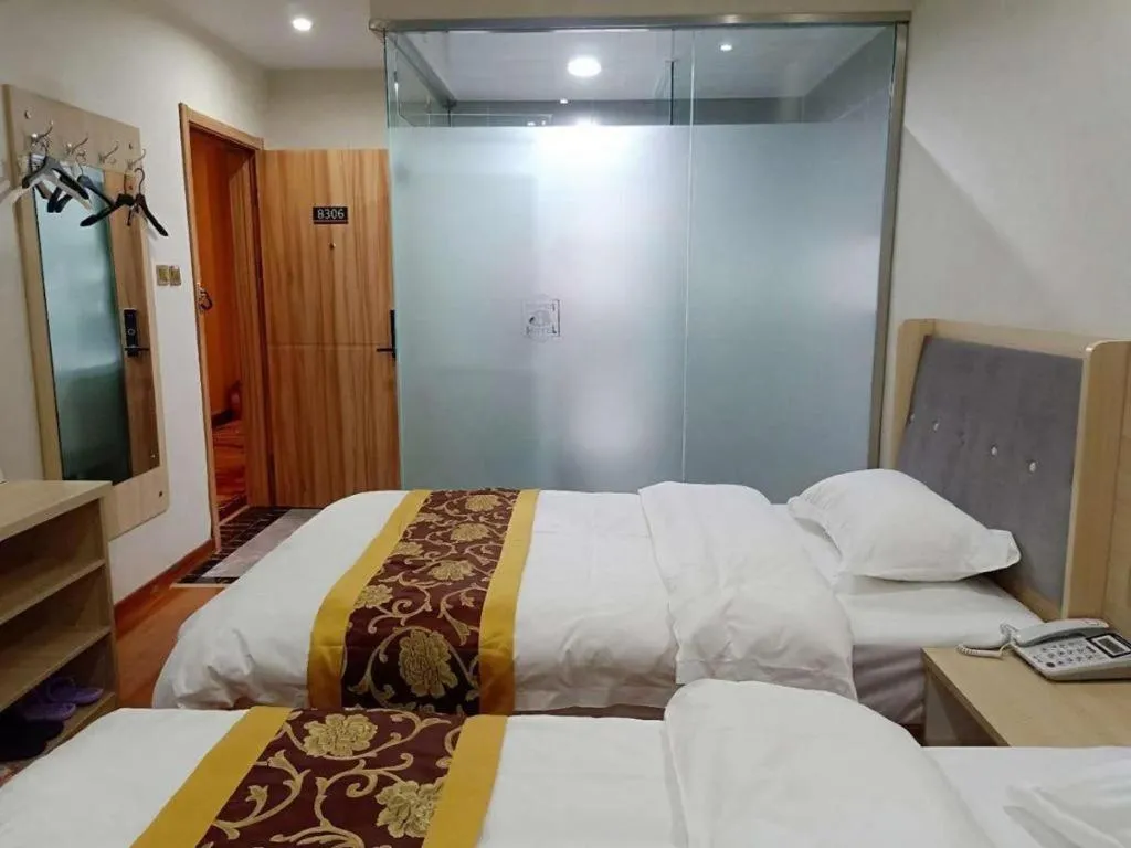 Bed in Super 8 Hotel Dingzhou Chongwen Street