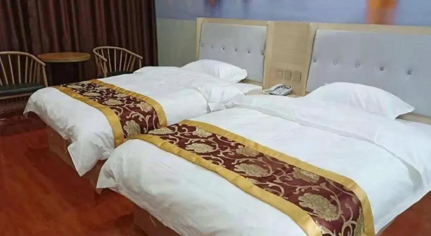 Bed in Super 8 Hotel Dingzhou Chongwen Street