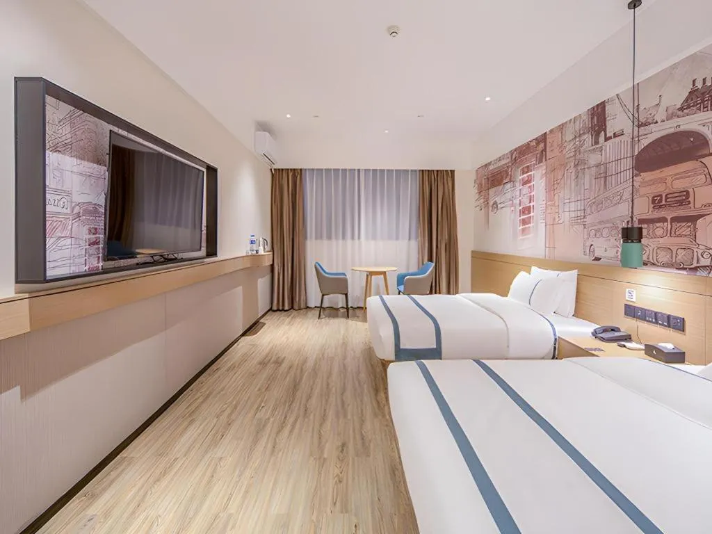 Bed in City Comfort Inn Wuzhou Xijiang Thrid Bridge