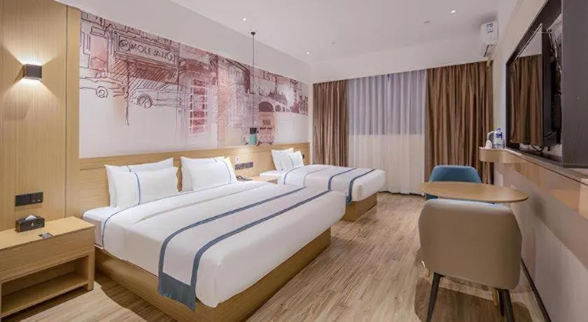Bed in City Comfort Inn Wuzhou Xijiang Thrid Bridge