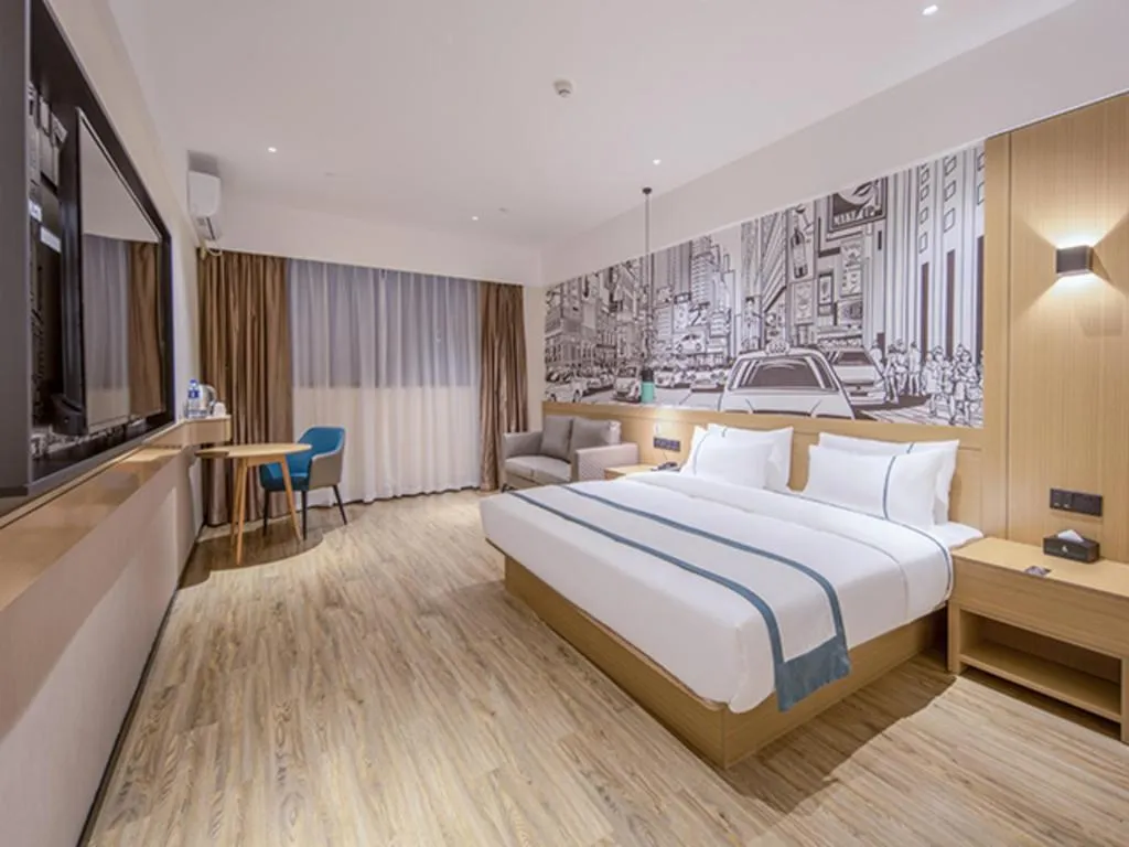 Bed in City Comfort Inn Wuzhou Xijiang Thrid Bridge