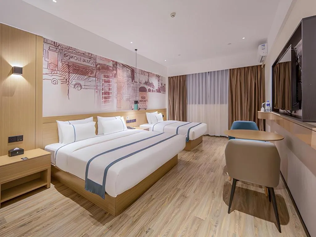 Bed in City Comfort Inn Wuzhou Xijiang Thrid Bridge