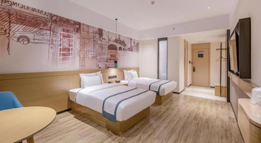 Bed in City Comfort Inn Wuzhou Xijiang Thrid Bridge
