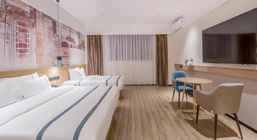 Bed in City Comfort Inn Wuzhou Xijiang Thrid Bridge