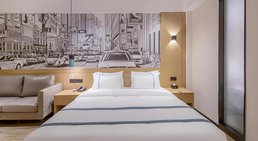 Bed in City Comfort Inn Wuzhou Xijiang Thrid Bridge