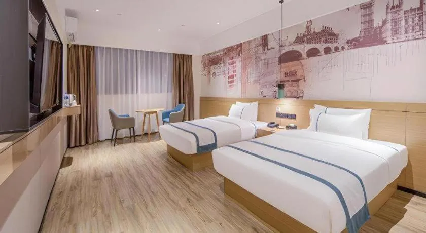 Bed in City Comfort Inn Wuzhou Xijiang Thrid Bridge