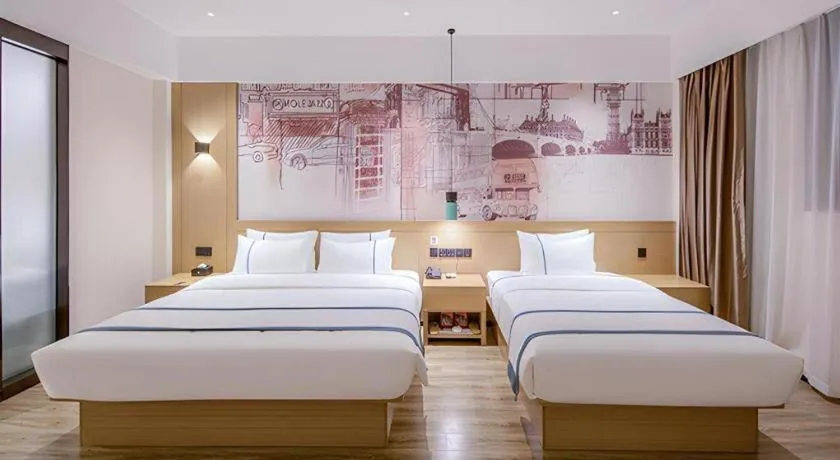 Bed in City Comfort Inn Wuzhou Xijiang Thrid Bridge