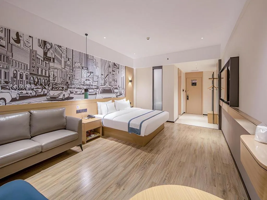 Bed in City Comfort Inn Wuzhou Xijiang Thrid Bridge