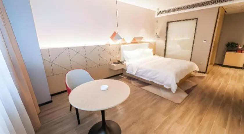 Bed in Borrman Hotel Yongzhou High Speed Railway Station