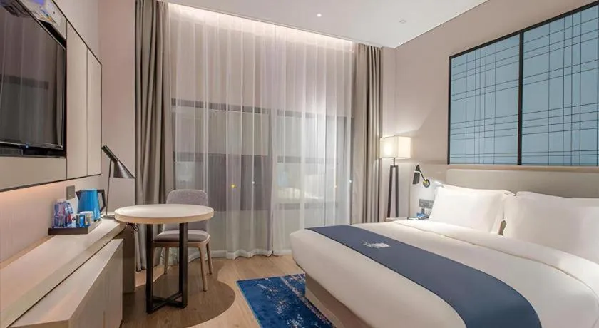 Bed in Echarm Hotel Fangchenggang Qisha