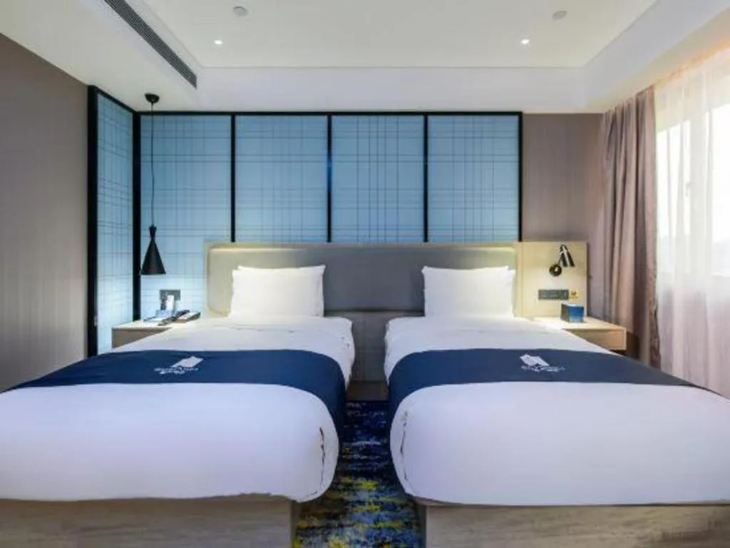 Bed in Echarm Hotel Fangchenggang Qisha