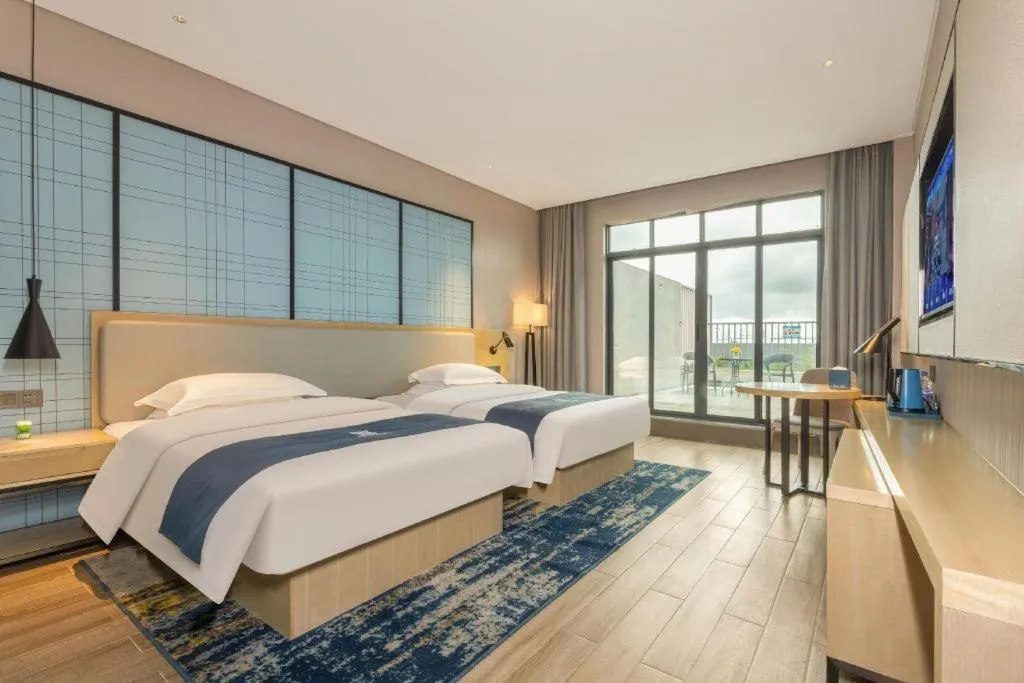 Bed in Echarm Hotel Fangchenggang Qisha