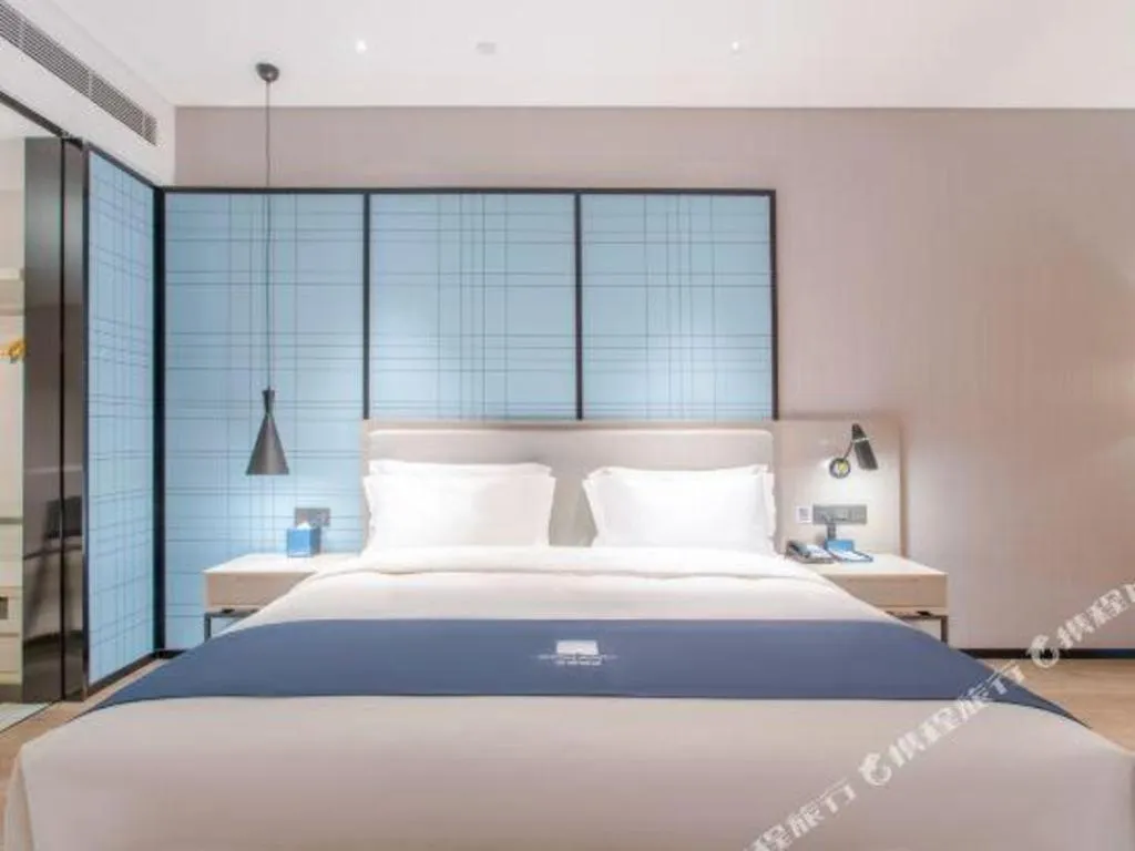 Bed in Echarm Hotel Fangchenggang Qisha