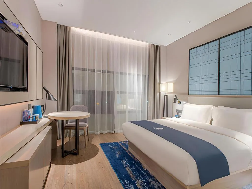 Bed in Echarm Hotel Fangchenggang Qisha