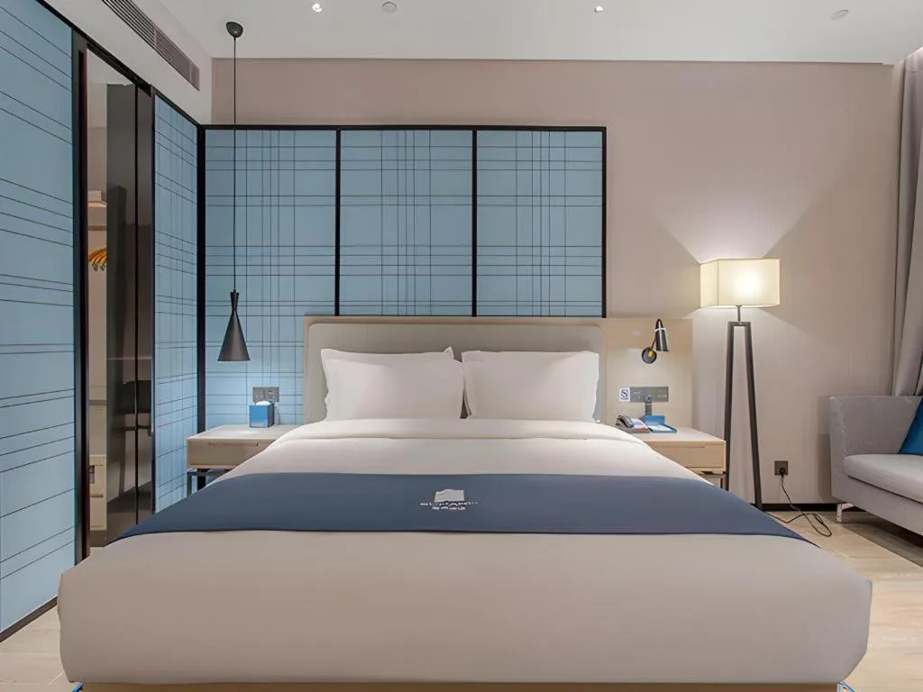 Bed in Echarm Hotel Fangchenggang Qisha