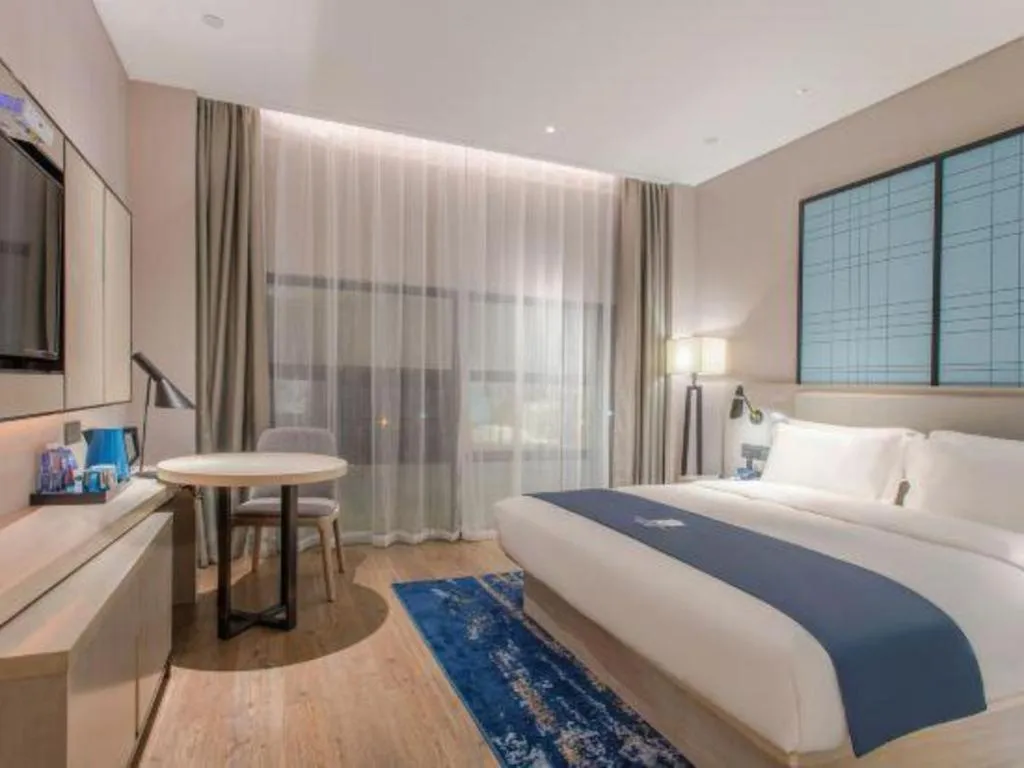 Bed in Echarm Hotel Fangchenggang Qisha