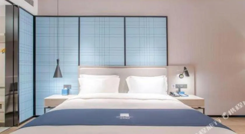 Bed in Echarm Hotel Fangchenggang Qisha