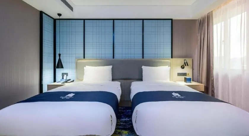 Bed in Echarm Hotel Fangchenggang Qisha