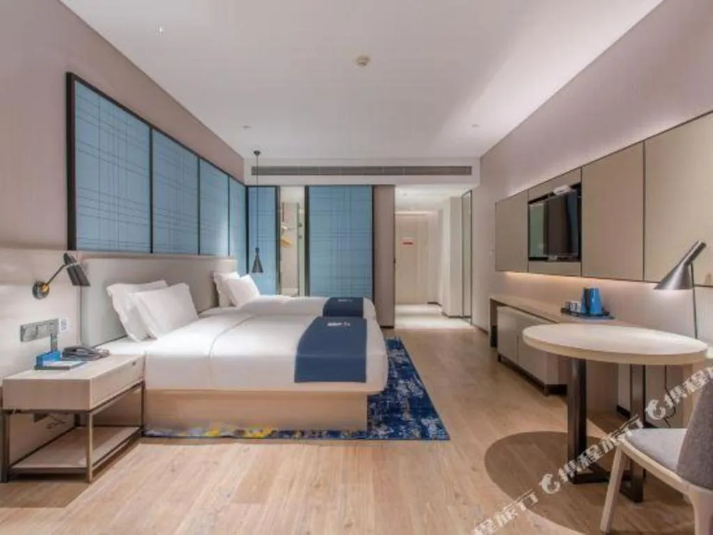 Bed in Echarm Hotel Fangchenggang Qisha