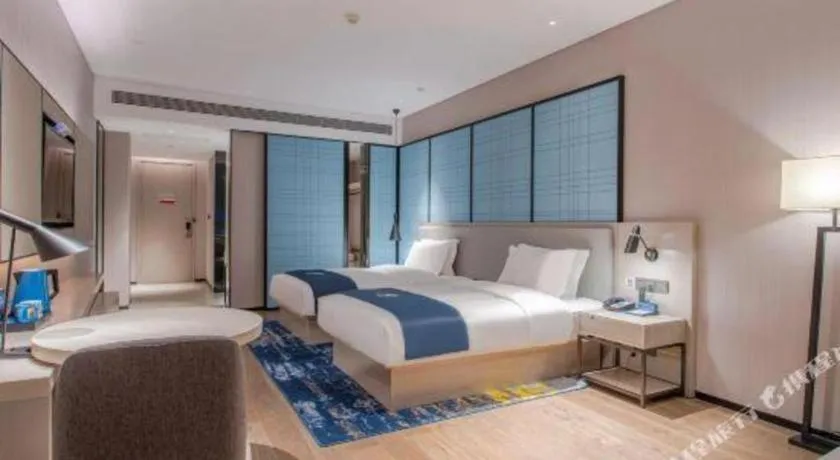 Bed in Echarm Hotel Fangchenggang Qisha