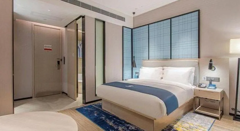 Bed in Echarm Hotel Fangchenggang Qisha