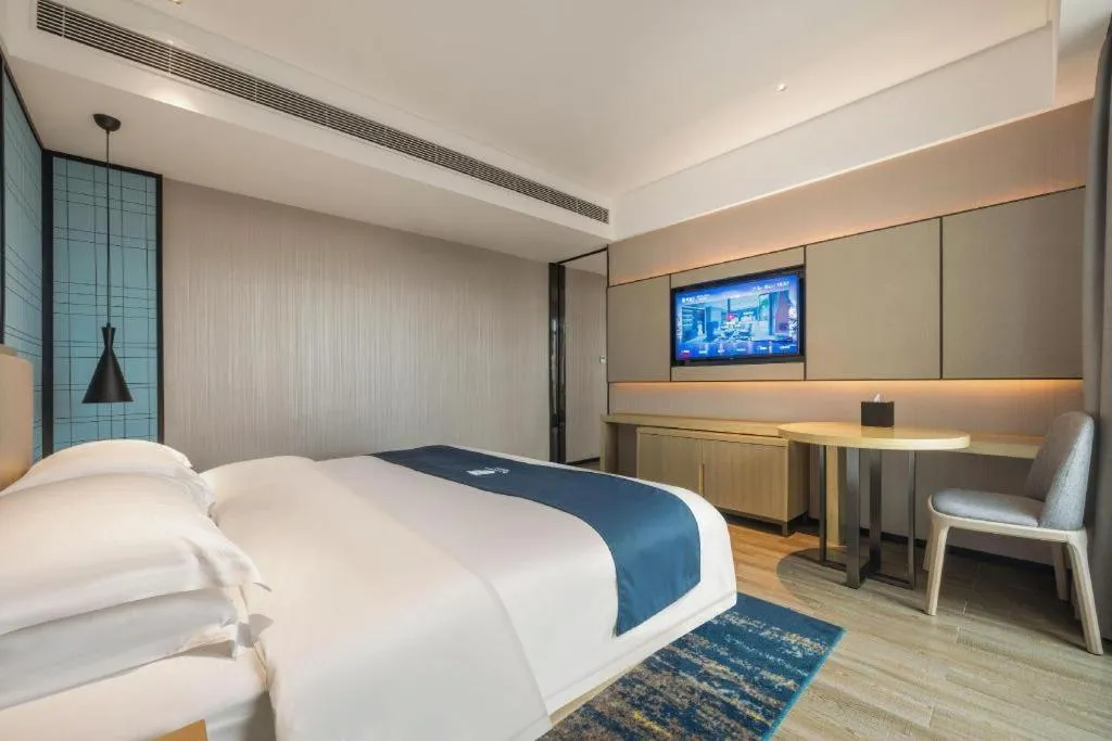 Bed in Echarm Hotel Fangchenggang Qisha