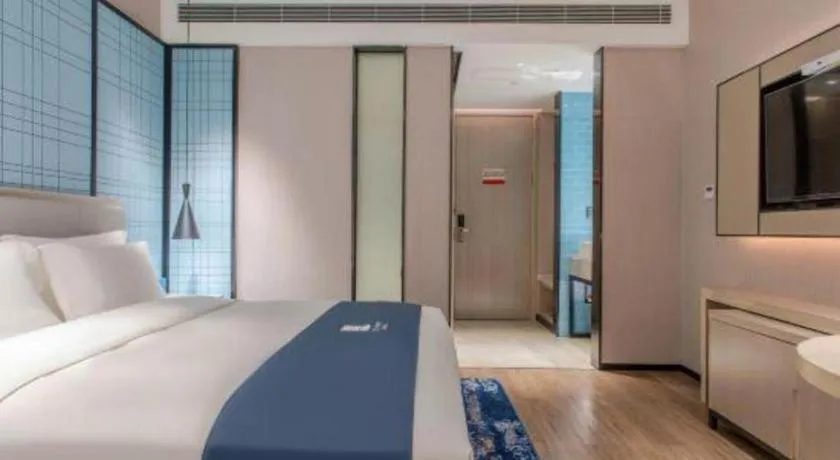 Bed in Echarm Hotel Fangchenggang Qisha