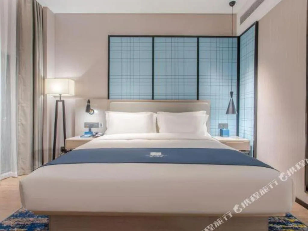 Bed in Echarm Hotel Fangchenggang Qisha