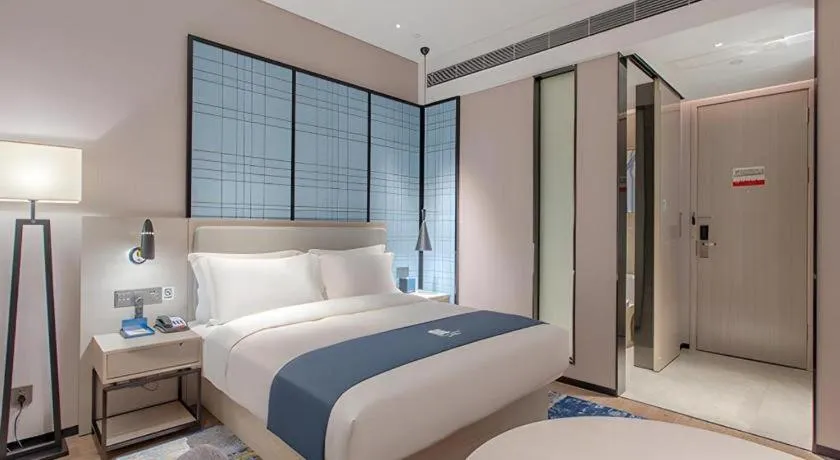 Bed in Echarm Hotel Fangchenggang Qisha