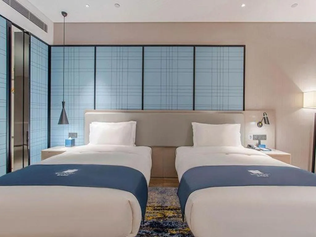 Bed in Echarm Hotel Fangchenggang Qisha