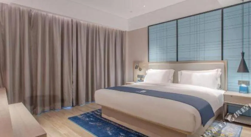 Bed in Echarm Hotel Fangchenggang Qisha