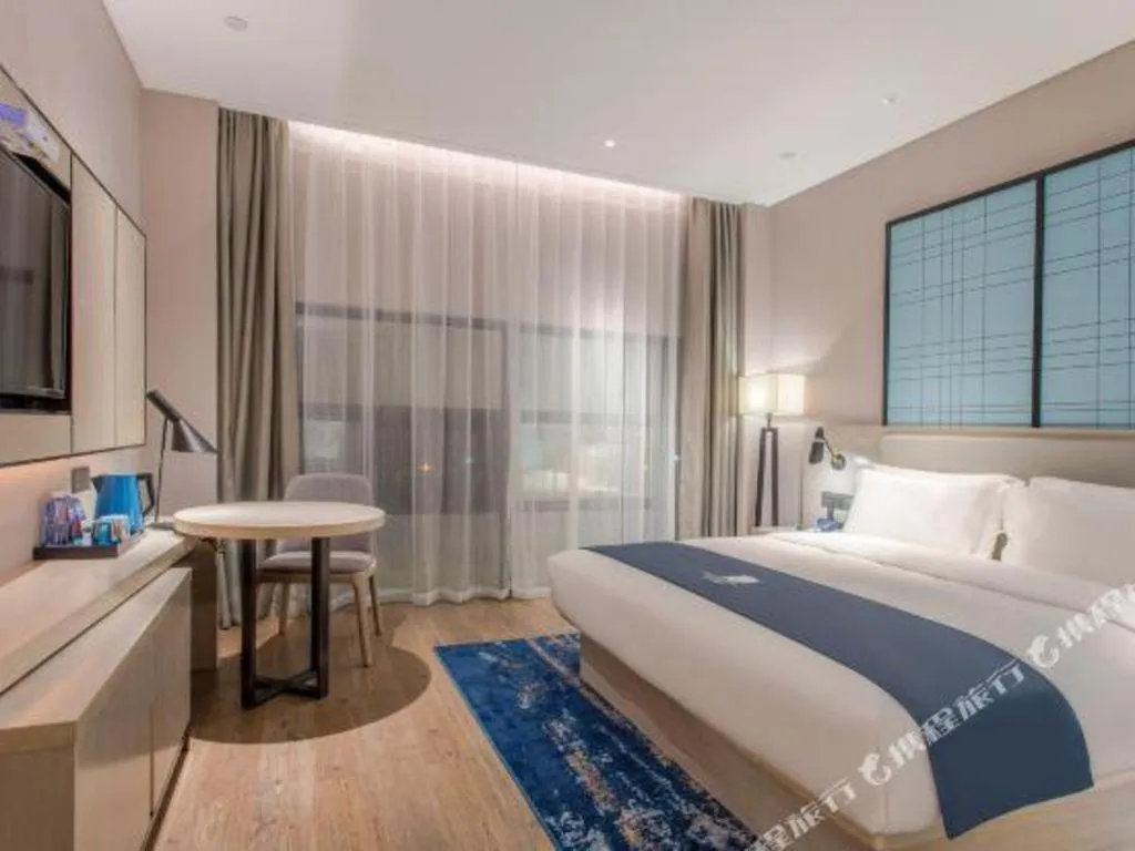 Bed in Echarm Hotel Fangchenggang Qisha