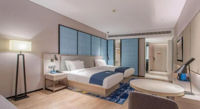 Bed in Echarm Hotel Fangchenggang Qisha