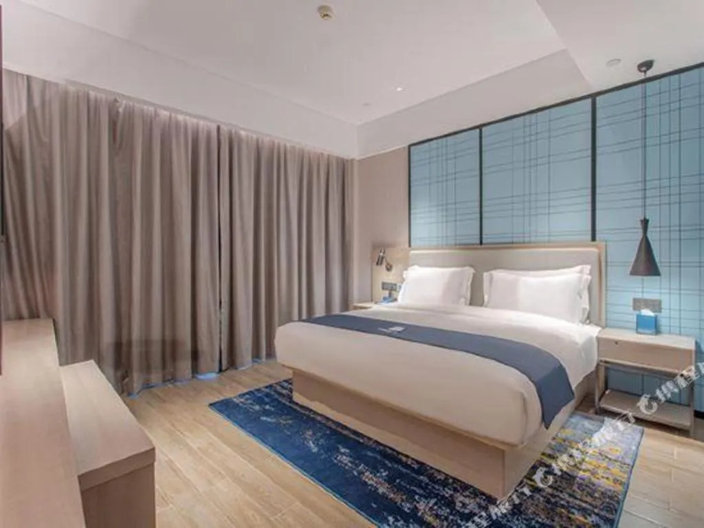 Bed in Echarm Hotel Fangchenggang Qisha